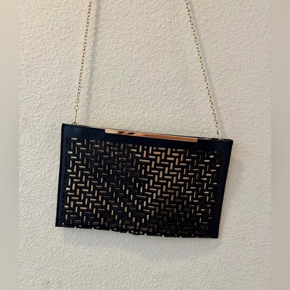 New York & Company Handbags - Chic Black Cutout Clutch with Gold Chain